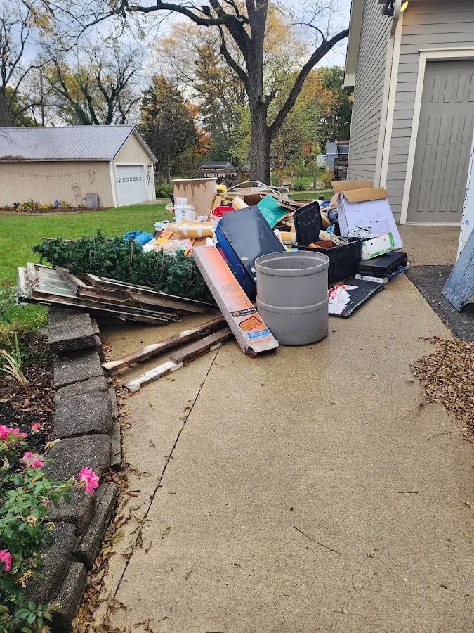 Dumpster being loaded with debris for 10 Yard Dumpster Rental in Vernon Hills